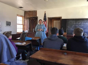 one room schoolteacher teaching at schoolhouse