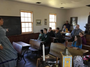 one room schoolteacher at historic 1850 schoolhouse