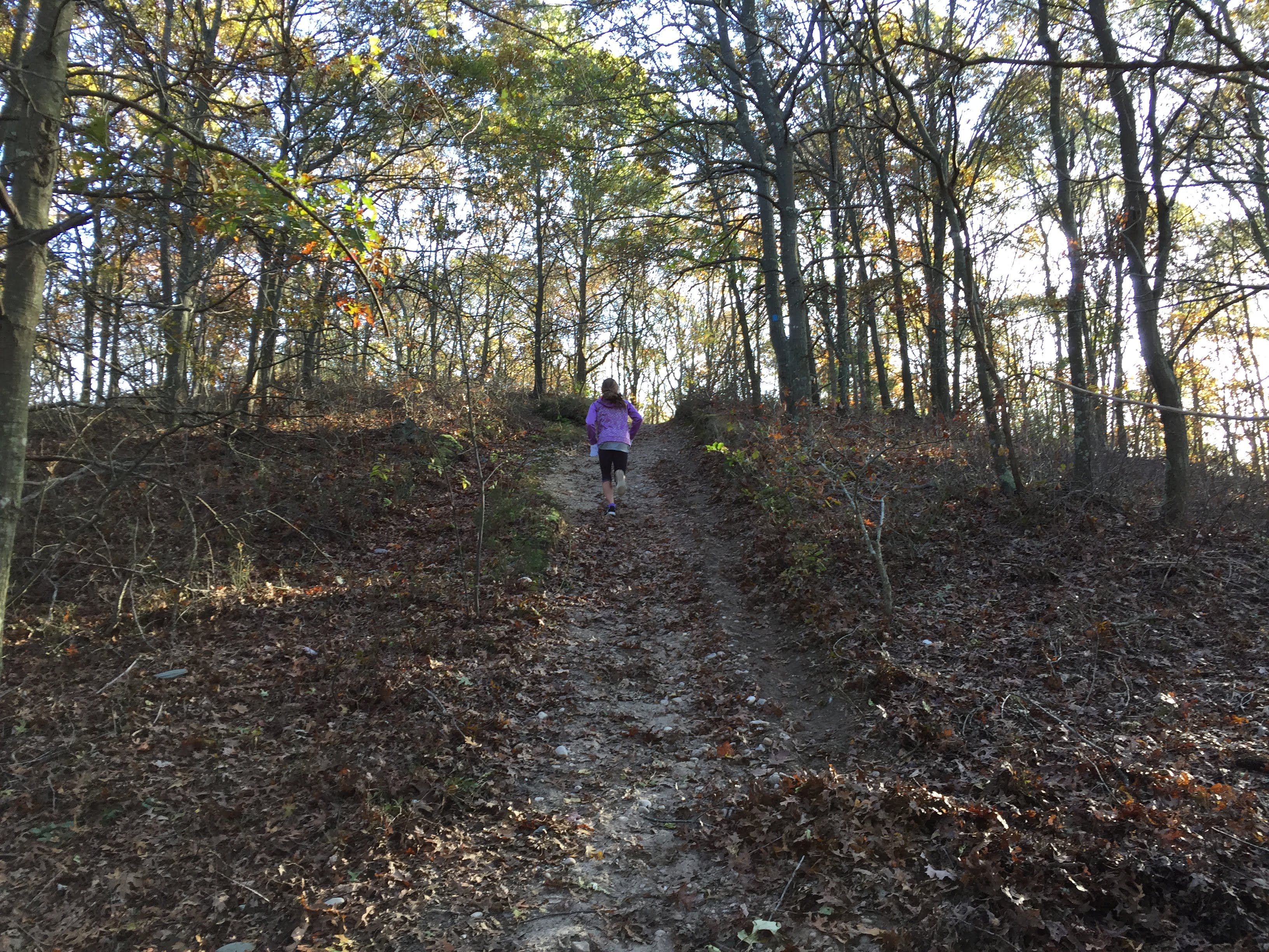 Anna running up large hill